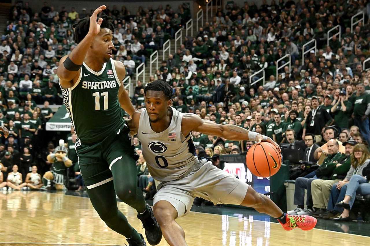 Penn State Nittany Lions guard Kanye Clary (0) dribbles past Michigan State Spartans guard A.J. Hoggard (11) during the first half at Jack Breslin Student Events Center.