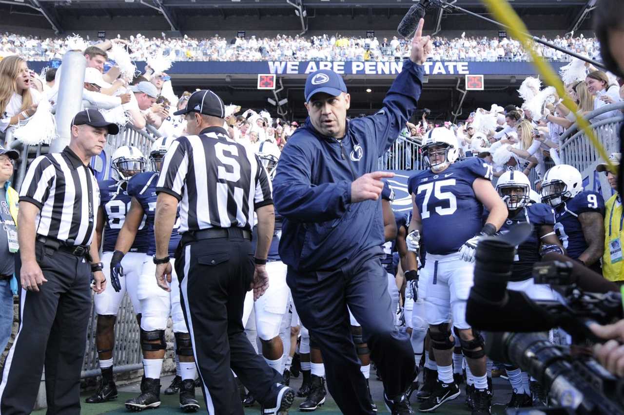 Penn State head coach Bill O’Brien runs on to the field.COLLEGE FOOTBALL Penn State Nittany Lions vs Michigan Wolverines in a Big Ten matchup at Beaver Stadium, State College.Photo by Jeremy Drey10/12/2013