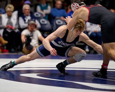 Braeden Davis shoots for a takedown.