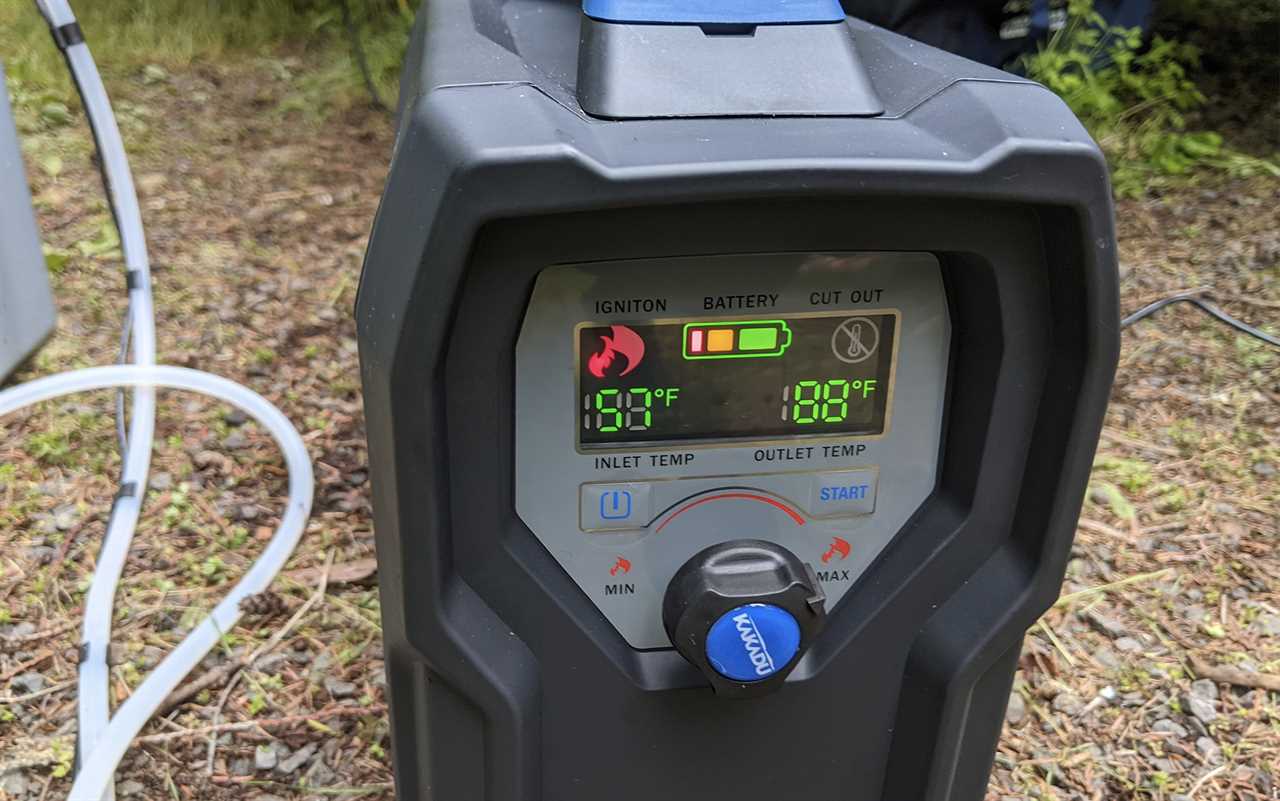 The display panel of the Kakadu camping shower showing high power, high heat, and a flame signal.