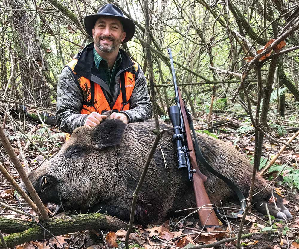 john b. snow with large boar